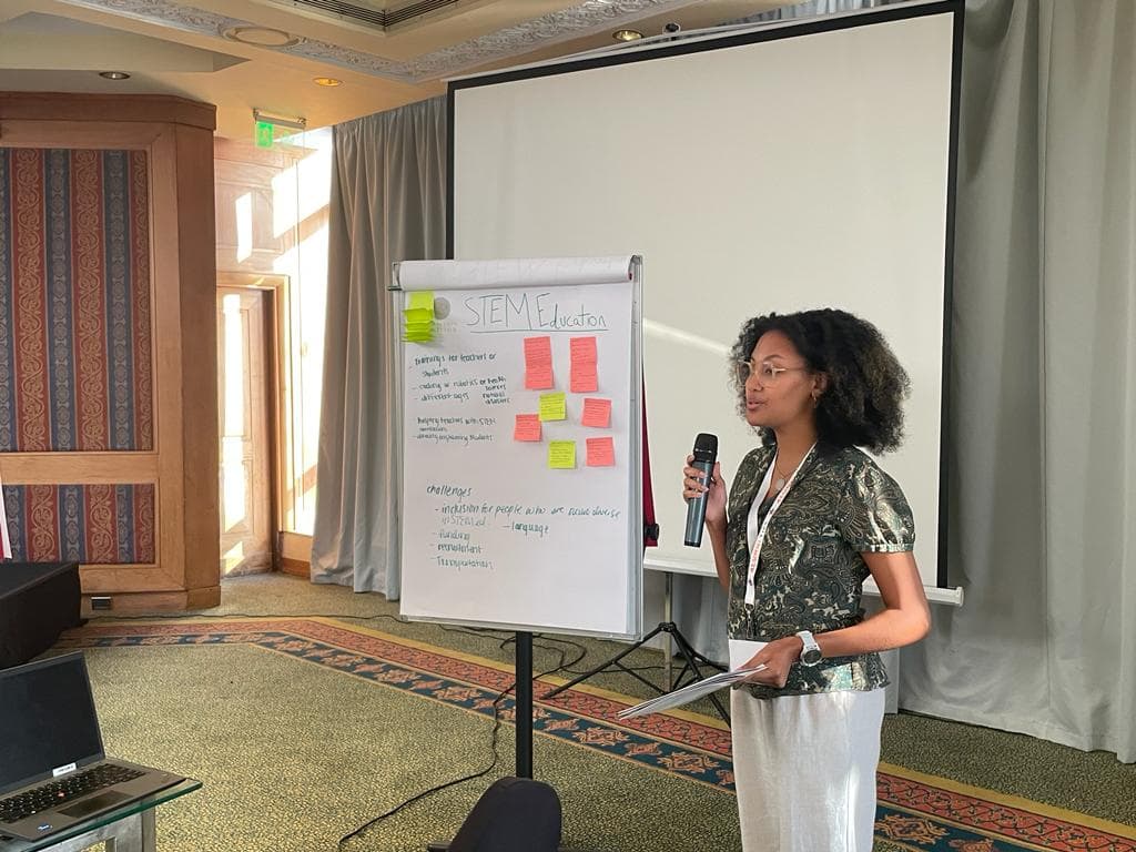 Selam presenting at a STEM education seminar breakout session